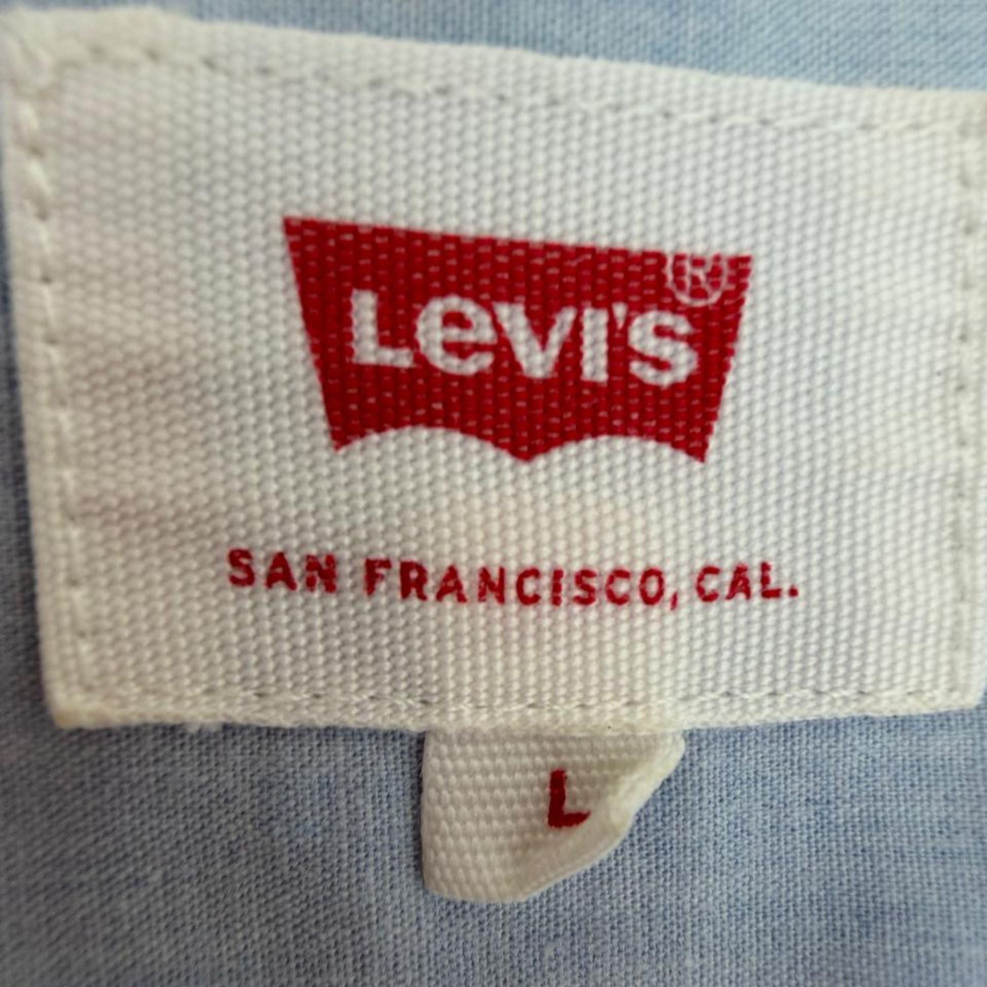 Levi’s light blue denim shirt (men’s L)